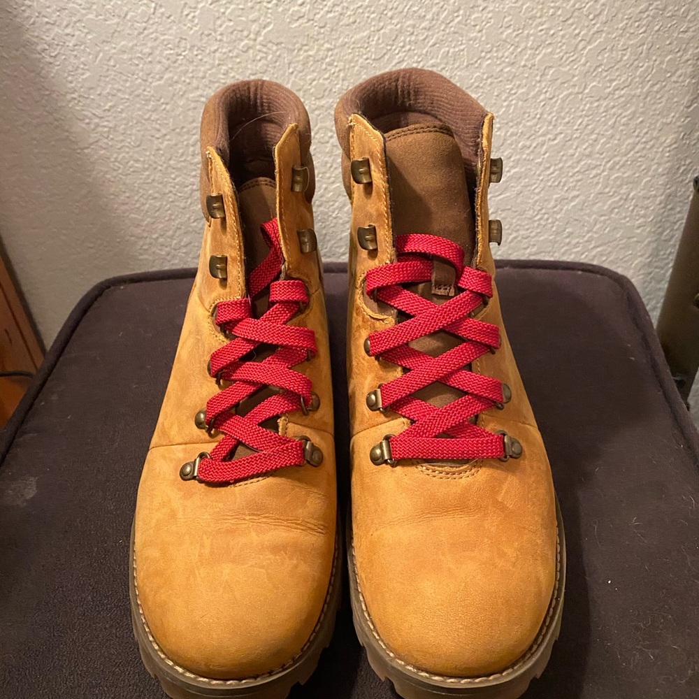 Brown Timberland boots with red laces